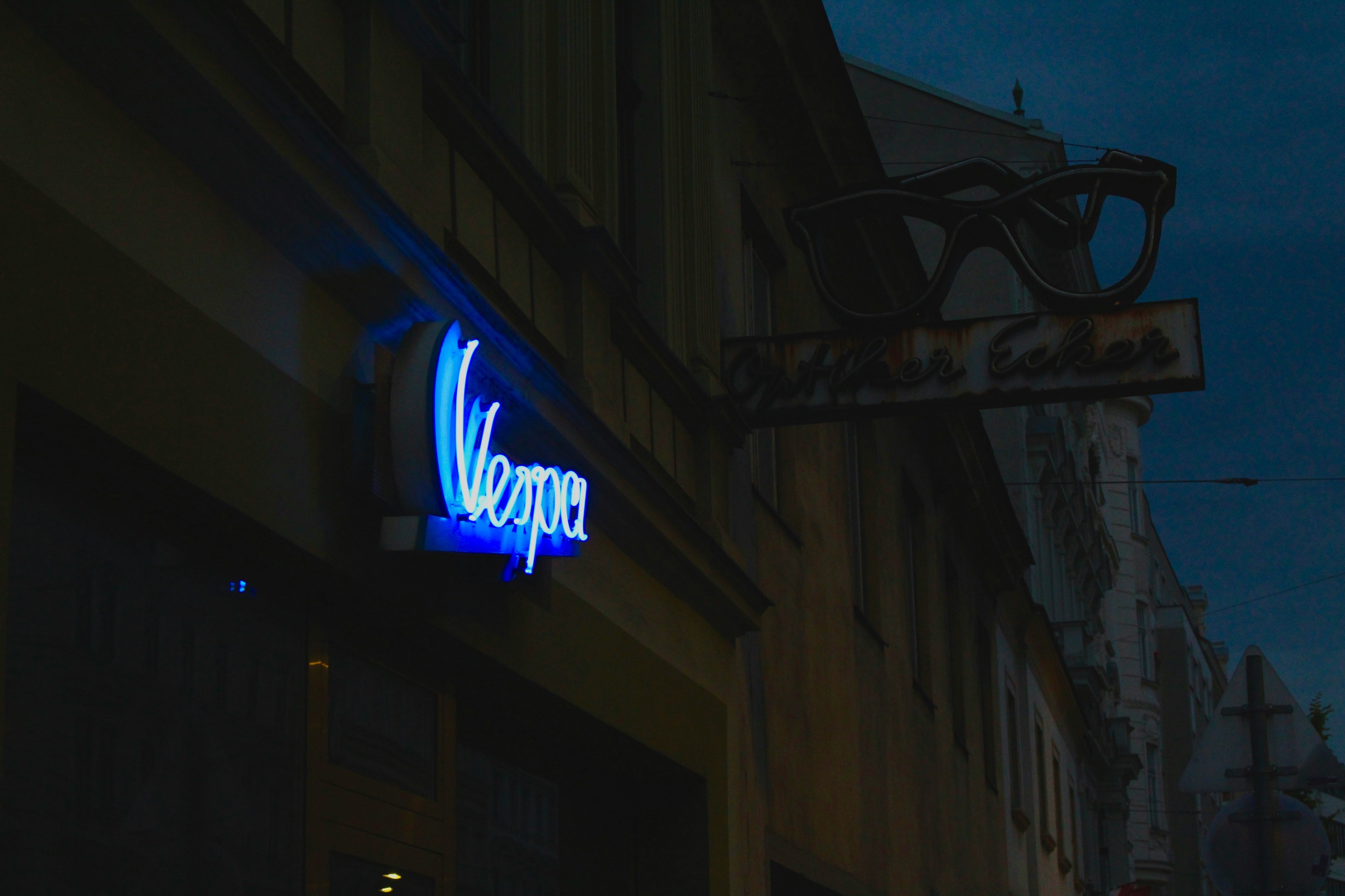 Neon sign glowing at dusk